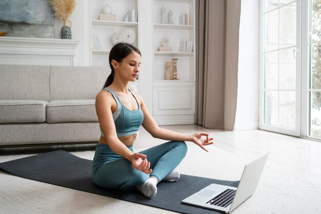 Woman training at home alone