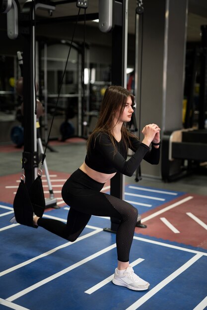 Woman training with weight lifting