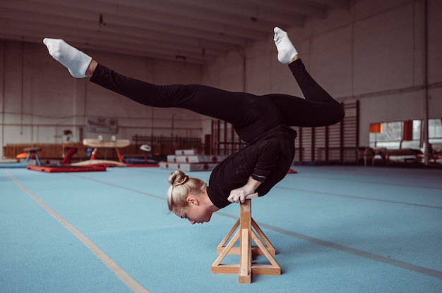 Woman training on wooden pieces