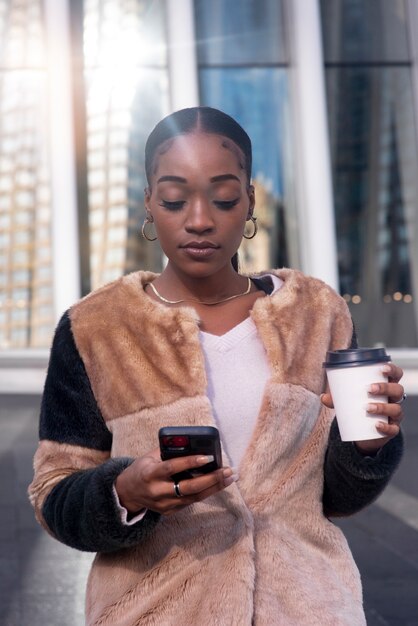 Woman traveling through city with her coffee