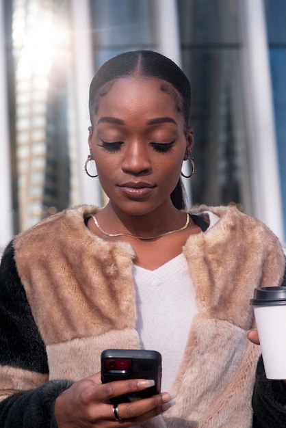 Woman traveling through city with her coffee