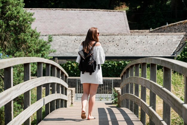 Woman traveling in a white cute dress