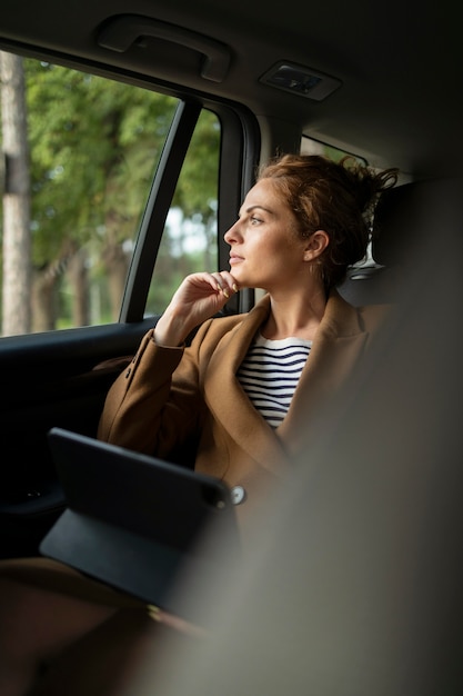 Woman traveling with her car