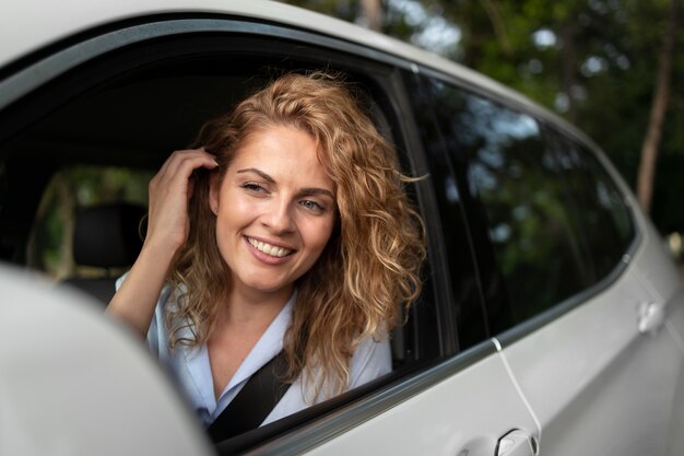 Woman traveling with her car