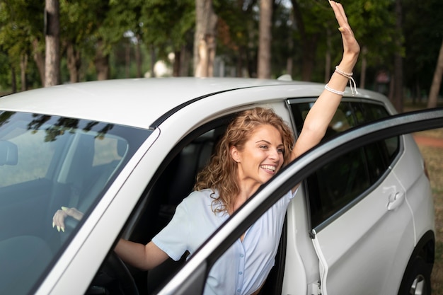 Woman traveling with her car