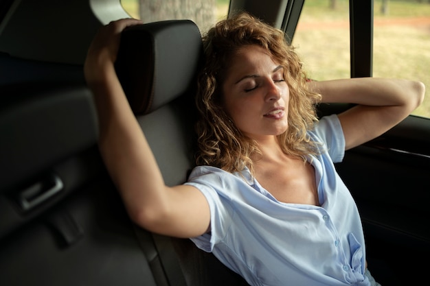 Woman traveling with her car