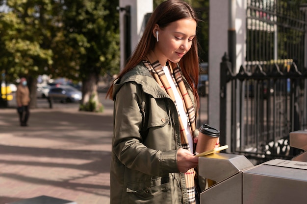 Woman at the turnstiles using her card