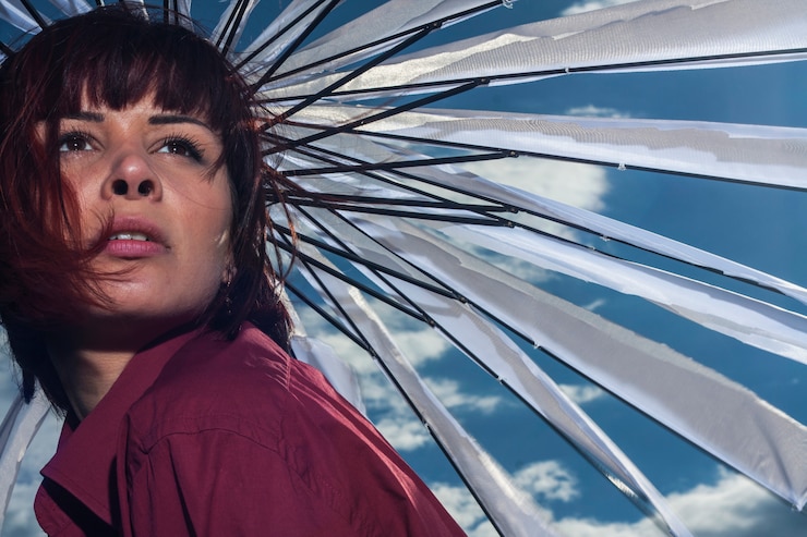 Free Photo woman under an umbrella