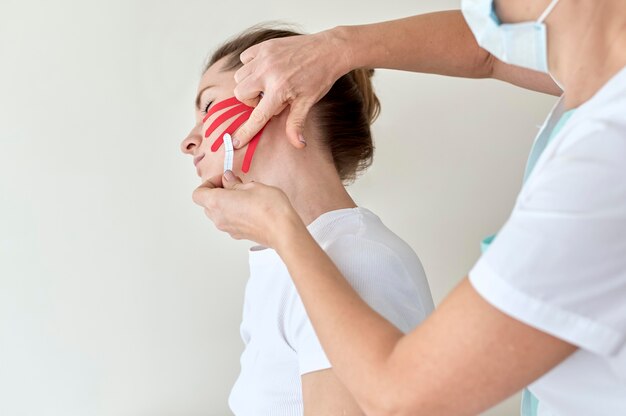 Woman undergoing therapy with physiologist