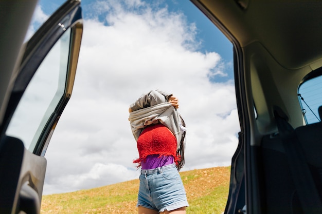 Woman undresses in travel