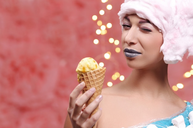 Free photo woman in unusual dress made of marshmallow and wig of cotton candy