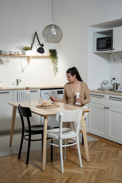 Woman using breast feeding pump