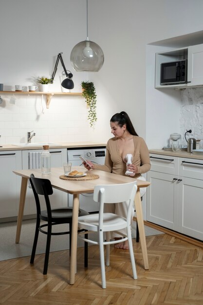 Woman using breast feeding pump