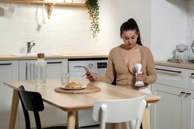 Woman using breast feeding pump