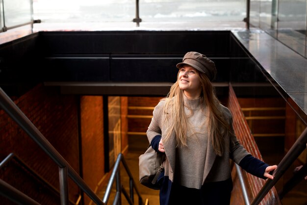 Woman using the city's subway stairs