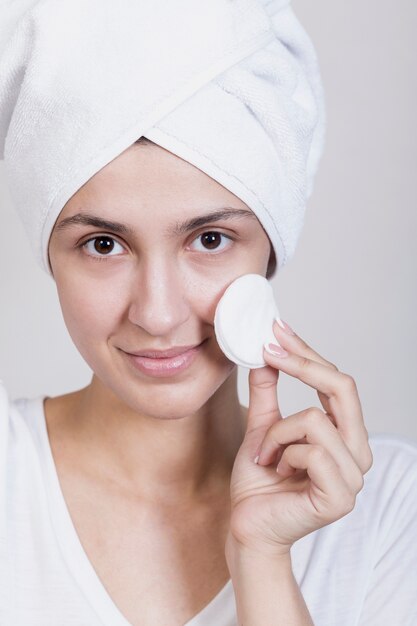 Woman using cotton pads