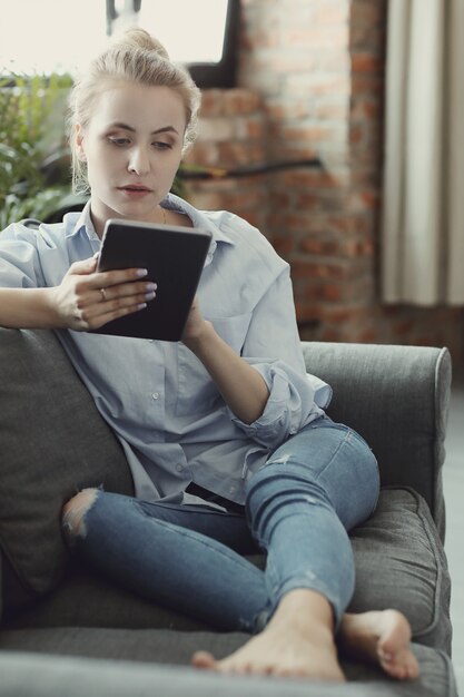 woman using digital tablet or smartphone
