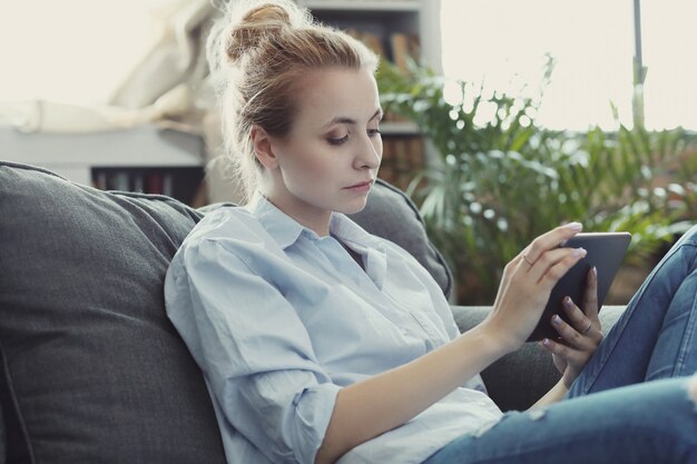 woman using digital tablet or smartphone