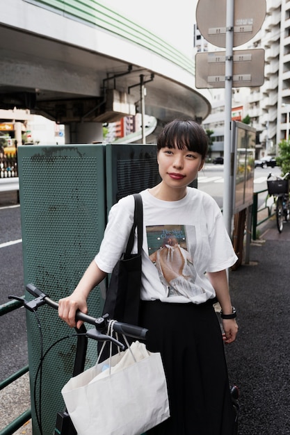 Woman using electric bicycle in the city