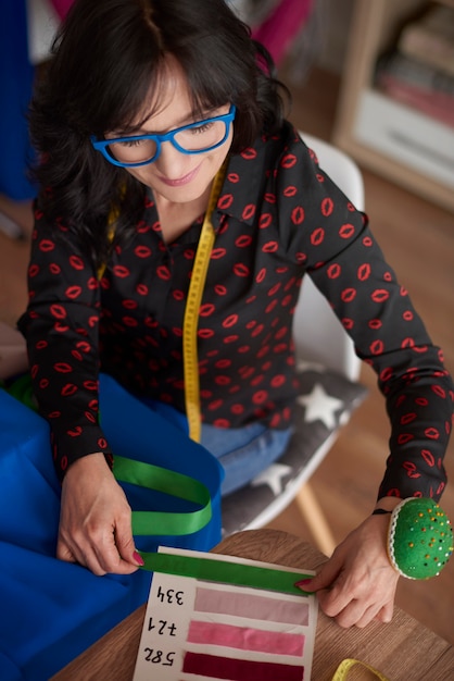 Woman using a fabric pattern board
