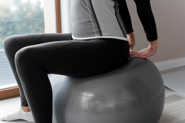 Woman using a fitness ball for her exercises