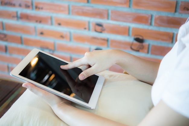 Woman using her tablet close-up