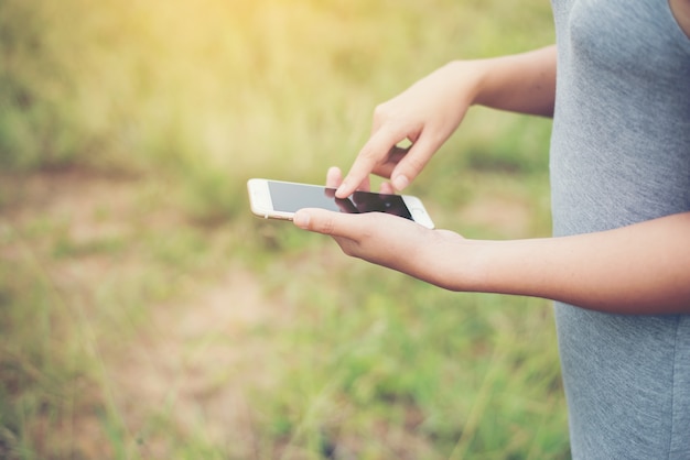 Woman using his phone