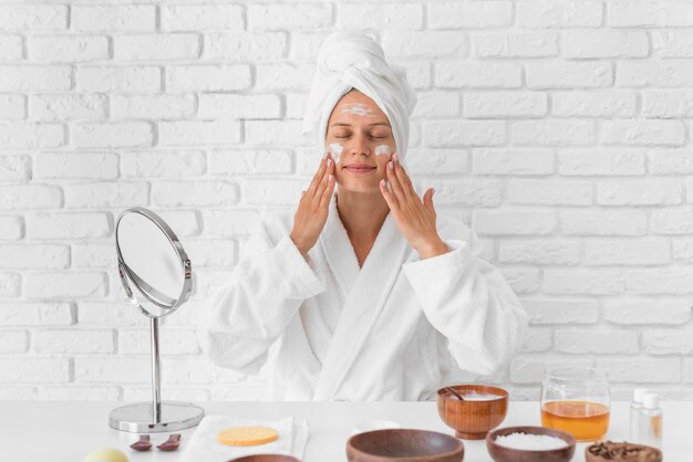 Woman using homemade remedy medium shot