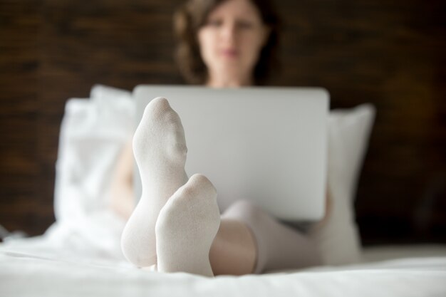 Woman using laptop at home