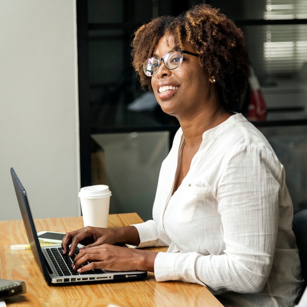 Woman using a laptop in a meeting room