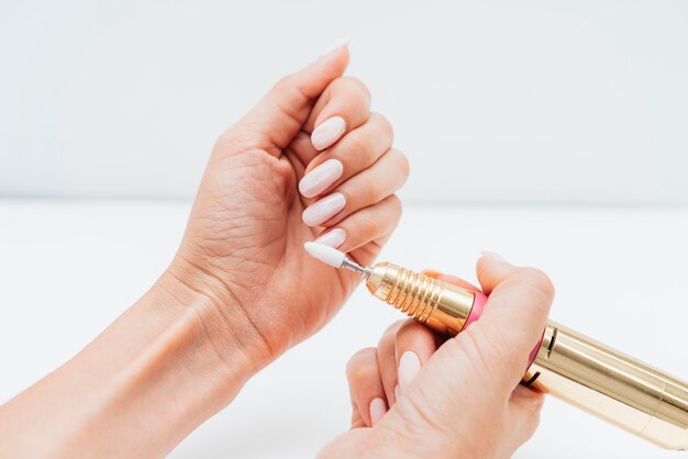 Woman using a nail file high view