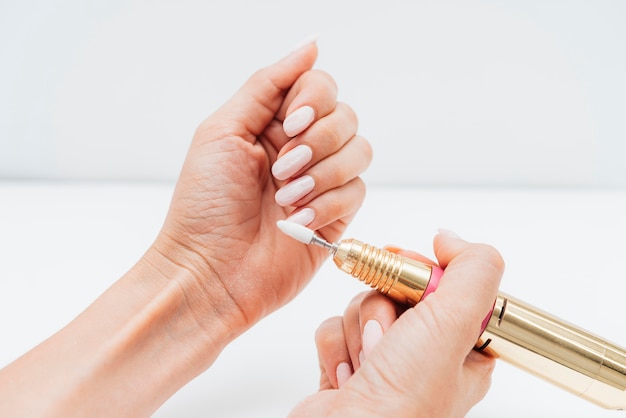 Woman using a nail file high view