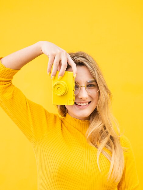 Woman using an old camera