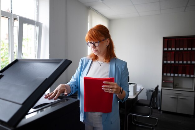 Woman using printer at the office