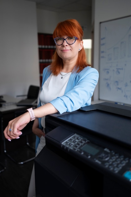 Woman using printer at the office