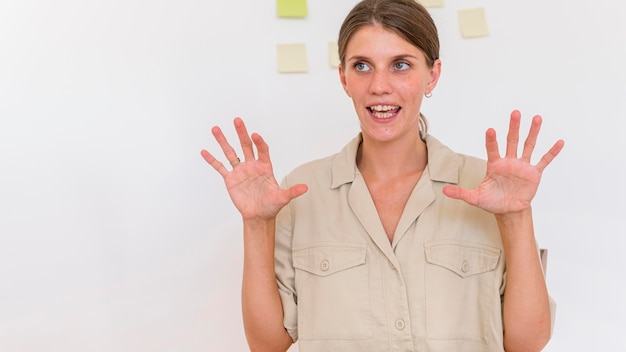 Free photo woman using sign language to convey something