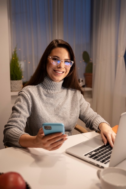 Free photo woman using smartphone as a habit