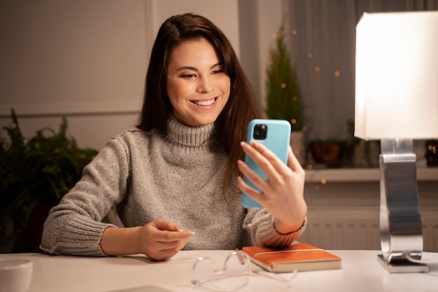 Woman using smartphone as a habit