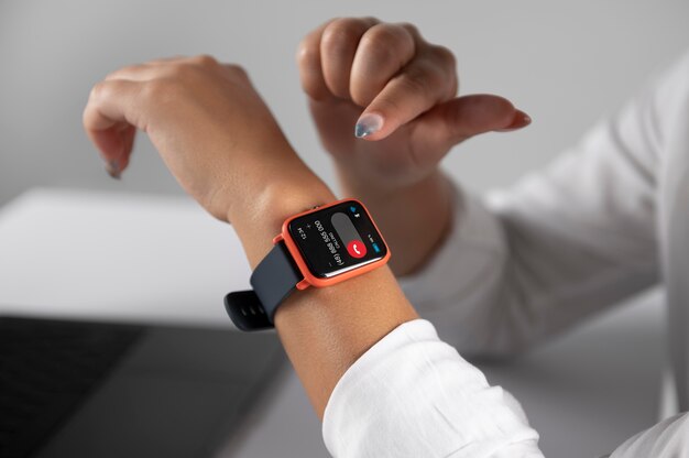 Woman using a smartwatch with a digital assistant