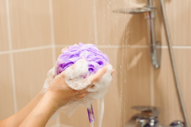 Blonde Girl Using Soap In The Bathroom Free Photo