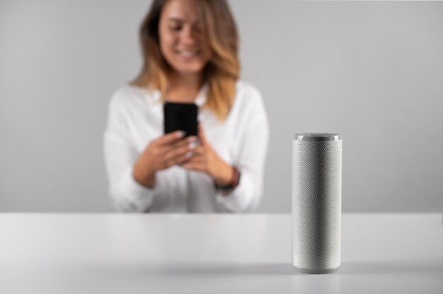 Woman using a speaker digital assistant