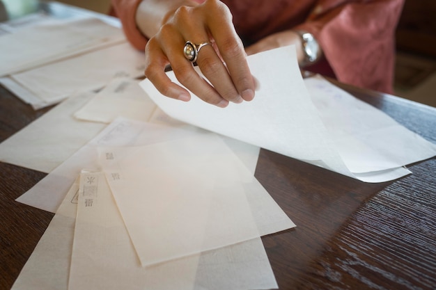 Free photo woman using special made paper for origami