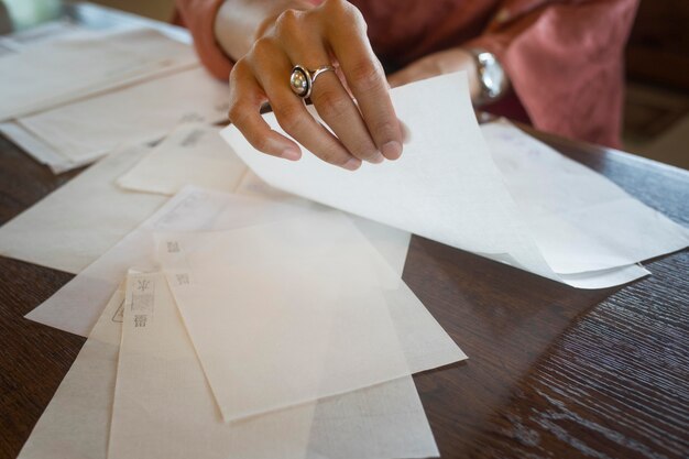 Woman using special made paper for origami