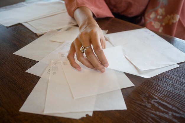 Woman using special made paper for origami