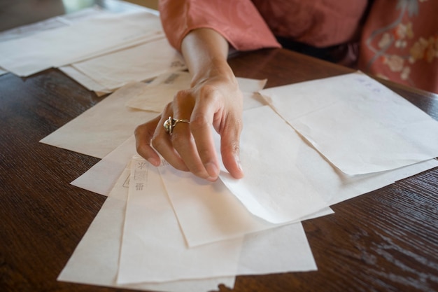 Woman using special made paper for origami