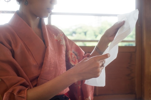 Woman using special made paper for origami