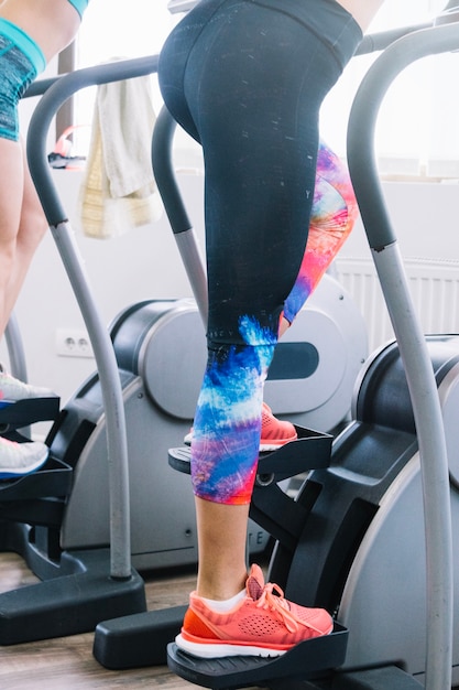 Woman using step machine