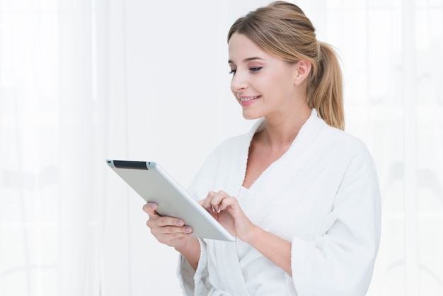 Woman using a tablet in a spa