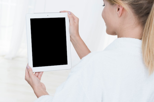 Woman using a tablet in a spa