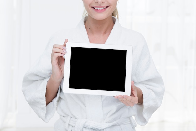 Woman using a tablet in a spa